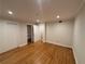 Spacious bedroom featuring hardwood floors, closet with shelving, and white trim at 3119 Colonial Way # H, Atlanta, GA 30341