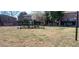 Open common area with a water fountain, benches, and manicured lawns at 3119 Colonial Way # H, Atlanta, GA 30341