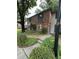 Traditional home exterior featuring a brick facade, bay windows, and well-maintained landscaping at 3119 Colonial Way # H, Atlanta, GA 30341