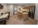 Kitchen featuring stainless appliances, view to the living room, and breakfast area at 3119 Colonial Way # H, Atlanta, GA 30341
