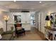 Open living room with built-in storage, an adjacent doorway and hardwood flooring at 3119 Colonial Way # H, Atlanta, GA 30341