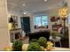 Bright living room showcasing the entry, front window and adjacent seating area with hardwood flooring at 3119 Colonial Way # H, Atlanta, GA 30341