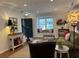 Cozy living room with hardwood floors, window seat, and comfortable seating at 3119 Colonial Way # H, Atlanta, GA 30341