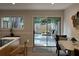 Dining area showcases view of fenced patio with patio furniture, accessible through sliding glass door at 3119 Colonial Way # H, Atlanta, GA 30341