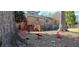 Community playground with mushroom seating and red metal play equipment near brick apartment building at 3119 Colonial Way # H, Atlanta, GA 30341