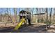Community playground with a swing set, slide, and climbing structure for outdoor fun at 3119 Colonial Way # H, Atlanta, GA 30341