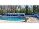 Refreshing community pool with a covered lounge area and surrounded by lush greenery at 3119 Colonial Way # H, Atlanta, GA 30341