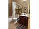 Charming bathroom with a shower/tub combo, vanity, and beach-themed decorations for a relaxing atmosphere at 313 India Ln, Canton, GA 30114