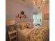 Charming bedroom with a chandelier, white furniture, and coordinated decor at 313 India Ln, Canton, GA 30114