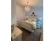 Cozy bedroom with chandelier, white furniture, and lots of bright natural light at 313 India Ln, Canton, GA 30114
