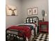 Woodland-themed bedroom with rustic decor, a cozy bed, and warm lighting for a comfortable and charming retreat at 313 India Ln, Canton, GA 30114