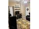 Inviting living room features a bar, comfortable seating, and a cozy rug, perfect for relaxation and entertaining at 313 India Ln, Canton, GA 30114