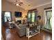 Open concept living room featuring neutral decor, fireplace, and lots of natural light at 313 India Ln, Canton, GA 30114