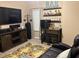 Inviting living room features a bar, comfortable seating, and a cozy rug, perfect for relaxation and entertaining at 313 India Ln, Canton, GA 30114