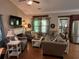 Comfortable living room with neutral decor, a fireplace, and lots of natural light at 313 India Ln, Canton, GA 30114