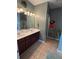 Large main bathroom with double sinks, tile floors, and natural lighting at 313 India Ln, Canton, GA 30114