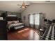 Spacious main bedroom with a high ceiling, ceiling fan, and two bright windows at 313 India Ln, Canton, GA 30114