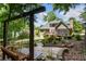 Expansive backyard featuring mature trees, terraced garden, a wooden deck, and vinyl siding at 4561 Jenkins Way, Douglasville, GA 30135