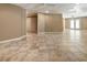 Spacious finished basement with tile flooring and recessed lighting perfect for entertaining or relaxing at 4561 Jenkins Way, Douglasville, GA 30135