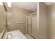 Well-lit bathroom with white vanity, shower, and neutral walls, creating a clean and functional space at 4561 Jenkins Way, Douglasville, GA 30135