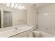 Bathroom featuring tub/shower combo, large mirror, vanity, and neutral finishes at 4561 Jenkins Way, Douglasville, GA 30135