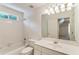 Bathroom with white vanity, tub/shower combo, and neutral finishes at 4561 Jenkins Way, Douglasville, GA 30135