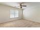 Cozy bedroom featuring carpet floors, ceiling fan, and a large window at 4561 Jenkins Way, Douglasville, GA 30135