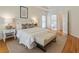 Bright bedroom with ensuite bathroom, hardwood floors, and neutral decor, a peaceful retreat with ample natural light at 4561 Jenkins Way, Douglasville, GA 30135
