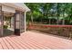 Spacious wooden deck with access to the screened porch and views of the landscaped backyard; great for outdoor gatherings at 4561 Jenkins Way, Douglasville, GA 30135