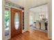 View of the front door and dining room with hardwood floors from the foyer at 4561 Jenkins Way, Douglasville, GA 30135