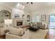 Spacious living room with fireplace, built-in bookshelves, and comfortable seating, perfect for relaxing and entertaining at 4561 Jenkins Way, Douglasville, GA 30135