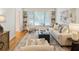 Cozy living room with built-in shelves, large window and hardwood floors at 4561 Jenkins Way, Douglasville, GA 30135