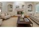 Inviting living room features a brick fireplace, built-in shelving, and neutral decor creating a cozy atmosphere at 4561 Jenkins Way, Douglasville, GA 30135