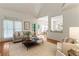 Bright living room with hardwood floors, a neutral color palette, and backyard access, offering a seamless indoor-outdoor flow at 4561 Jenkins Way, Douglasville, GA 30135