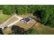 Charming home with a private pool, gazebo, long driveway, and fenced in yard surrounded by lush greenery at 540 Benton Rd, Covington, GA 30014