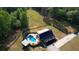 Aerial shot of a beautiful home featuring a sparkling pool, charming gazebo, and private driveway, set in lush surroundings at 540 Benton Rd, Covington, GA 30014