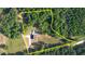 Aerial view of the property with boundaries marked, showcasing a home, pool, and the surrounding forest at 540 Benton Rd, Covington, GA 30014