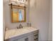 Bathroom with granite countertops and a rustic framed mirror at 540 Benton Rd, Covington, GA 30014
