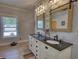 Bathroom featuring a double vanity and lots of natural light at 540 Benton Rd, Covington, GA 30014