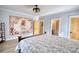 Inviting bedroom featuring stylish decor, a spacious layout, and luxury vinyl plank flooring at 540 Benton Rd, Covington, GA 30014