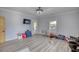 Light and bright bonus room with gray wood floors and access to the outdoors at 540 Benton Rd, Covington, GA 30014