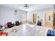 Large bonus room with gray wood floors and lots of space for activities at 540 Benton Rd, Covington, GA 30014