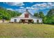 Beautiful barn-style home with inviting front porch and manicured landscaping at 540 Benton Rd, Covington, GA 30014