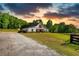 Stunning farmhouse-style home with a barn door accent and a well-manicured lawn at 540 Benton Rd, Covington, GA 30014
