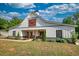 Lovely modern barn house with a charming porch area and beautifully landscaped surroundings at 540 Benton Rd, Covington, GA 30014