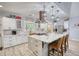 Bright kitchen with a large island, custom cabinets, stainless steel appliances, and modern fixtures at 540 Benton Rd, Covington, GA 30014