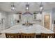 Stylish kitchen with an oversized island, designer lighting, and sleek stainless-steel appliances at 540 Benton Rd, Covington, GA 30014