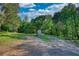 Scenic land with a storage shed and a car port nestled among the trees at 540 Benton Rd, Covington, GA 30014