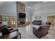 Spacious living room with stone fireplace, wood floors, and french doors leading to outdoor area at 540 Benton Rd, Covington, GA 30014