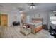 Main bedroom with gray wood floors, neutral walls, and lots of natural light at 540 Benton Rd, Covington, GA 30014